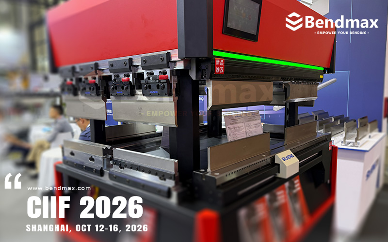 Close-up of press brake punch and die tooling installed in a bending machine, showing the tool interface and forming area.